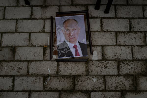 Broken picture frame of Russian president