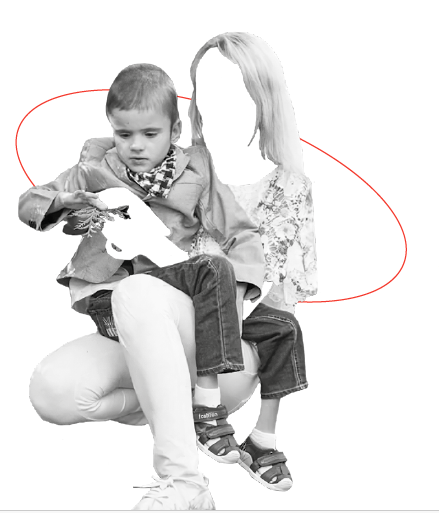 black and white image. a woman holds a young boy on her lap. The woman's face and hands are cut out of the photo so only her clothes and the hair on her head can be seen.
