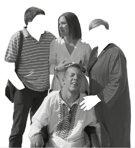 black and white photo of four people gathered together. a young man in a wheelchair is in front, a woman stands directly behind him looking to the person on her right. The two people on either side of her have their faces and arms cut out of the photo so you can only see their clothes and the hair on their head.