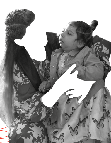 black and white image of a woman holding a young girl on her lap. The womans face and hands are cut out of the photo so you can only see her clothes and hair on her head