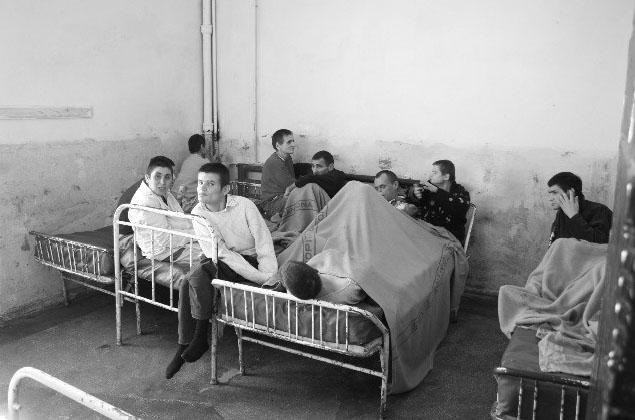 children huddled on beds together